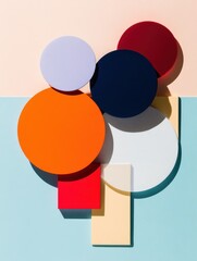 Colorful geometric shapes arranged artistically against a pastel background with shadows