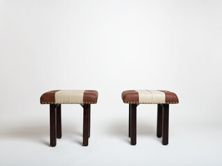Two stools with brown and beige leather, dark wood legs isolated on white background. Studio, set.