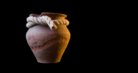 Old clay pot isolated on white background. Ceramic or clay jar