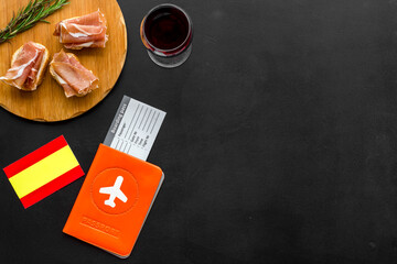Travel to Spain. Passport and airplane tickets with traditional Spanish meal