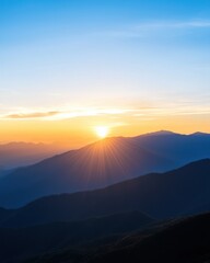 Obraz premium Majestic Sunrise Over Mountain Range with Vibrant Colors and Serene Landscape in the Early Morning Sky