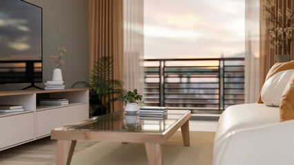 Glass top wooden table between TV and leather sofa in living room or bedroom with city view terrace.