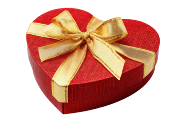 A close up of a red heart shaped box with a gold ribbon tied around it on a black background
