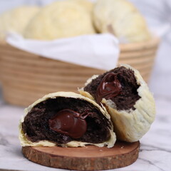 Chocolate pia bread with melted chocolate filling. in the photo with a white background
