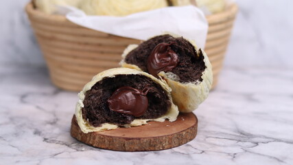 Chocolate pia bread with melted chocolate filling. in the photo with a white background