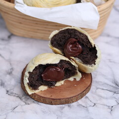 Chocolate pia bread with melted chocolate filling. in the photo with a white background