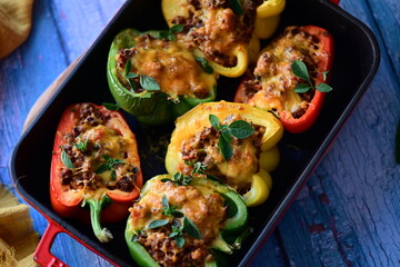 Stuffed Peppers with Meat, Rice, and Vegetables in a Baking Dish