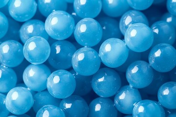 The image is a close up of blue spheres, some of which are larger