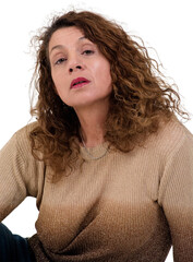 The Middle-Aged Woman with Brown Curly Hair Wearing Sparkly Sweater Sits in Natural Light.