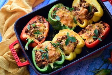 Stuffed Peppers with Meat, Rice, and Vegetables in a Baking Dish