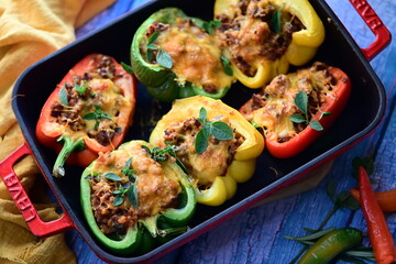 Stuffed Peppers with Meat, Rice, and Vegetables in a Baking Dish