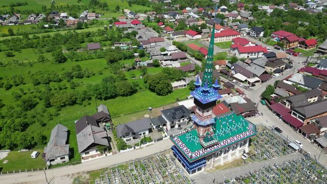 Aerial view of the Merry Cemetery in Sapanta, Romania, a unique cemetery known for its colorful tombstones