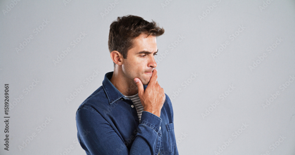 Poster Thinking, man and confused with doubt in studio for fake news, problem solving or brainstorming. Mockup space, puzzled and person contemplating with planning, solution and serious on gray background