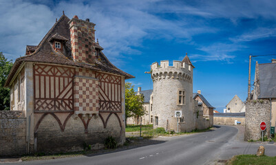 Commes, France - 05 15 2025: Bessin Bayeusain. Panoramic view of Commes manor with his tower,...