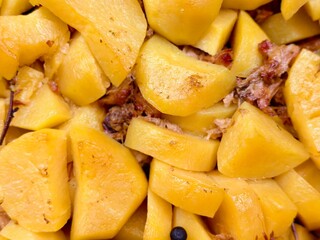 Hearty stew of tender potatoes infused with savory meat, perfect for a comforting meal on a chilly day