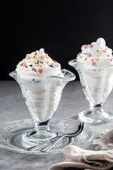 Whipped Cream Delight with Sprinkles on gray and black background