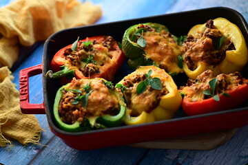 Stuffed Colorful Bell Peppers with Beef, Bulgur, and Cheese in Rustic Mediterranean Style