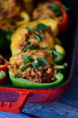 Stuffed Colorful Bell Peppers with Beef, Bulgur, and Cheese in Rustic Mediterranean Style