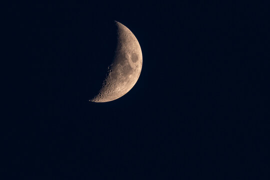 Detailed view of the waxing gibbous Moon against a black night sky. Surface craters and texture are clearly visible in this high-resolution astronomical photo.