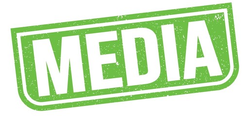 MEDIA text written on green stamp sign.