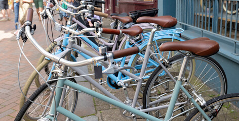 A row of blue parked bikes