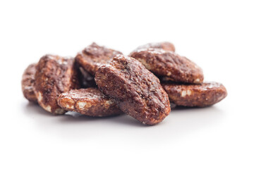 Pecan nuts coated in sugar and honey isolated on white background.