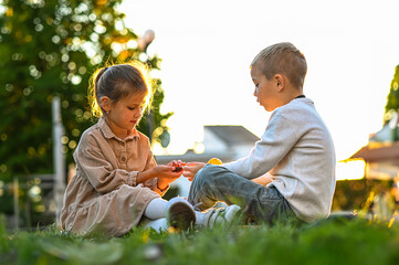 Two children play together on a quiet town street. Joyful childhood moment, friendship, outdoor fun, and community vibes in a peaceful neighborhood.