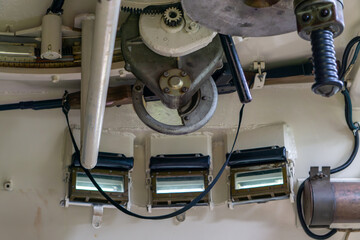 internal components of an armored vehicle, showing a turret rotation mechanism, gears, springs, and...