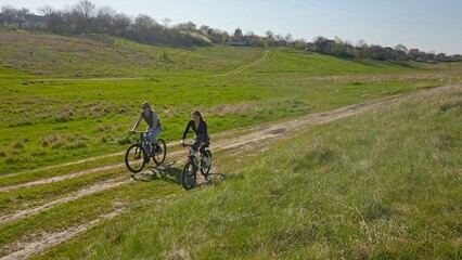 Couple Enjoys Tranquil Cycling Adventure on Rural Trail