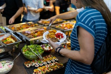 Buffet dining experience with a variety of dishes during a gathering in a casual setting