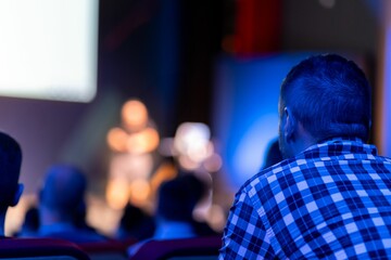 Attendees observe a speaker during a technology conference focused on innovation and development