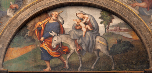 PIACENZA, ITALY - MAY 19, 2025: The fresco of Flight to Egypt in the church Basilica di Santa Maria di Campagna by  Pordenone (1531-1532).