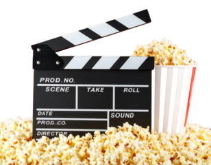 A film clapperboard and a striped popcorn container surrounded by popcorn on a black background.