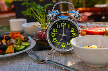 Alarm clock with IF (Intermittent Fasting) 16 and 8 diet rule and weight loss concept.-Diet plan concept