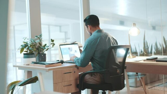 Documents, laptop screen and typing with business man at desk in office for start of job or work. Computer, finance and paperwork with employee sitting in chair for planning, report or research