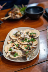 A deliciouslooking plate of food is sitting contently on a wooden table