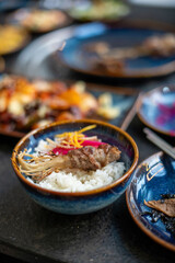 Savor the flavors of delicious Asian cuisine, featuring rice and a medley of fresh vegetables