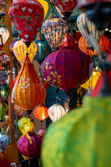 Colorful lanterns hang elegantly from the rooms ceiling