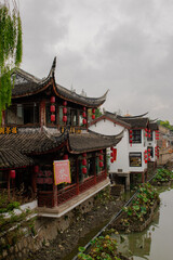 Shanghai, China, 11.10.2024: Cloudy morning along the canal reveals classic China: peaceful water,...