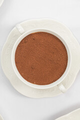 Top view on gourmet tiramisu dessert in a bowl
