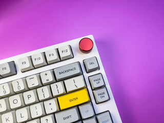 Gaming keyboard, isolated on purple background, copy space, flay lay. High quality photo