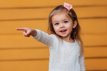 happy excited little girl child pointing