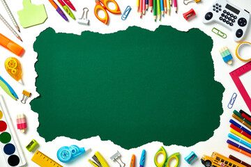 Back to school supplies flat lay with central green copy space for text. Education concept