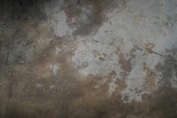 This close-up reveals the raw, aged texture of a polished concrete floor. Its surface exhibits a fascinating interplay of subtle variations in tone and intricate patterns.