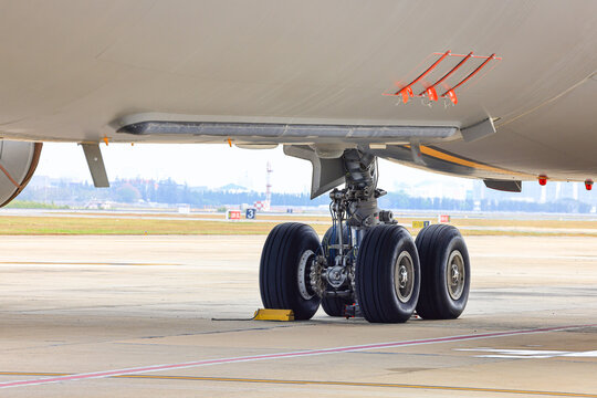 main landing gear of modern passenger aircraft taxi on taxi way. 