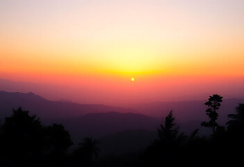 Beautiful scenic sunset over mountain silhouettes creating a peaceful nature landscape