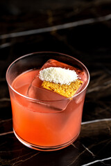 Elegant luxury cocktail in front of dark background