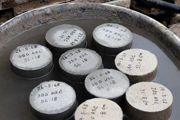 Concrete Cylinders Curing Process by Water in Concrete Mixer Bucket