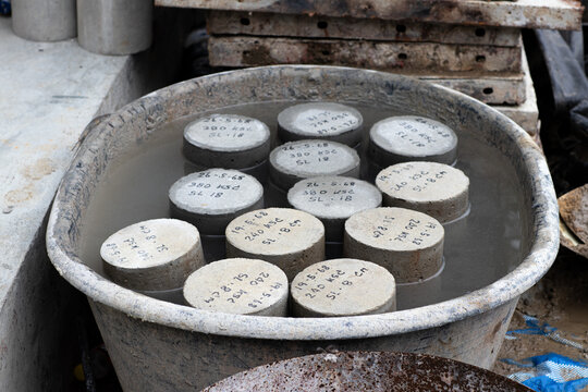 Concrete Cylinders Curing Process by Water in Concrete Mixer Bucket