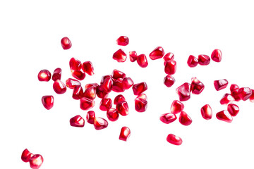 Scattered pomegranate seeds isolated on white background
